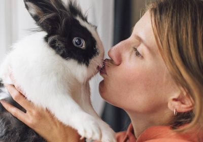 woman-petting-adorable-rabbit